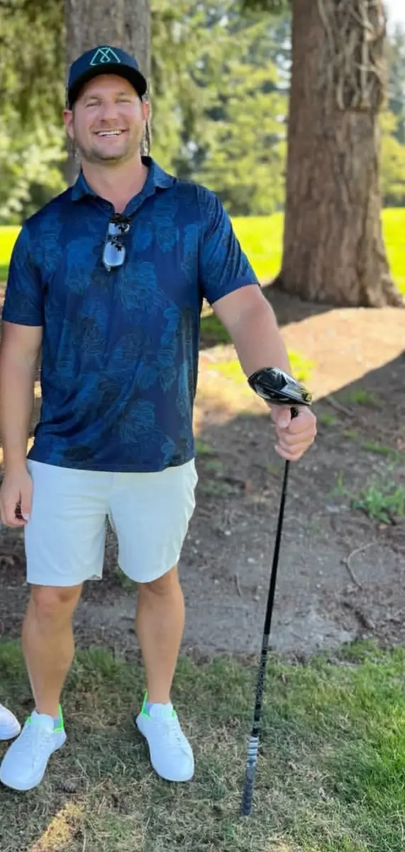 Robert Sears standing outdoors with a golf club